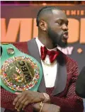  ?? AFP/Reuters photos ?? A bout between Wilder (left) and Joshua (right) would result in the first man to hold all four major heavyweigh­t titles. —