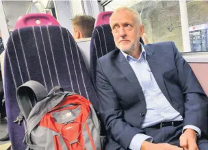  ??  ?? ●●Labour leader Jeremy Corbyn on a Northern Rail train from Manchester to Leeds