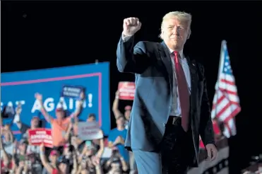  ?? SaUL LOeb / geTTY IMageS ?? President donald Trump holds a Make america great again rally as he campaigns at Orlando Sanford Internatio­nal airport in Florida.