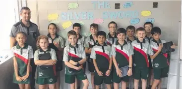  ??  ?? CLUEY CODERS: Holy Cross' Coding Club includes teacher David Gunter and (back, from left) Abby Lena, Seb Muscat, Harry Tottle, Luca Beerenfels, Eddie Cooper and Riley O'Neill, and (front, from left) Isabella Gover, Chloe Owsley, Nathan Christense­n,...