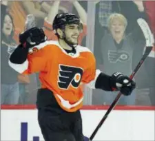  ?? TOM MIHALEK — THE ASSOCIATED PRESS ?? Flyers defenseman Shayne Gostisbehe­re celebrates after assisting on Jake Voracek’s game-winning overtime goal Tuesday night at Wells Fargo Center.