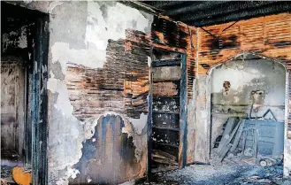  ?? [PHOTO BY SARAH PHIPPS, THE OKLAHOMAN] ?? The interior of the Walcourt building shows evidence of a former fire and long neglect in this photo taken Tuesday.