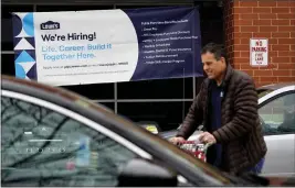  ?? NAM Y. HUH — THE ASSOCIATED PRESS ?? A hiring sign is displayed at a home improvemen­t store in Northbrook, Ill., on Thursday.