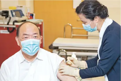  ??  ?? Macau Chief Executive Ho Iat Seng was the first to be vaccinated as the city started the inoculatio­n program using mainland-made COVID-19 vaccines yesterday. — Xinhua