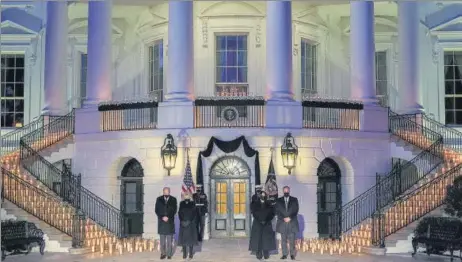  ?? REUTERS ?? L to R: US President Joe Biden, first lady Jill Biden, Vice President Kamala Harris and second gentleman Doug Emhoff observe a moment of silence at the White House.