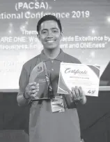  ??  ?? GRAJO with his awards for his short film entry ‘Pagsubok.’ He was also elected as PACSA’s Mindanao Core Group student representa­tive.