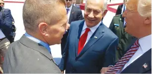  ?? (Twitter) ?? PUBLIC SECURITY MINISTER Gilad Erdan talks with US President Donald Trump yesterday at Ben-Gurion Airport as Prime Minister Benjamin Netanyahu looks on.