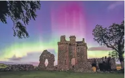  ?? Pictures: Fox in the Snow Photograph­y. ?? Top: Andy Clark captured the aurora borealis in the skies above Perth. Above: Katherine Fotheringh­am pictured the event at Balvaird Castle, near Glenfarg.