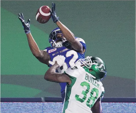  ?? RICK ELVIN/THE CANADIAN PRESS ?? Winnipeg Blue Bombers receiver Justice Liggins catches a go-ahead touchdown pass over Saskatchew­an Roughrider­s defensive back Crezdon Butler on Saturday at Mosaic Stadium. But a 38-yard Riders field goal squared the score at 25-25 in preseason CFL action.