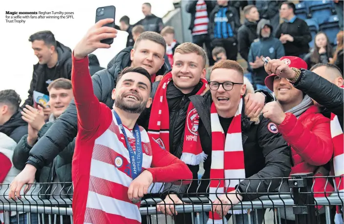  ?? ?? Magic moments Reghan Tumilty poses for a selfie with fans after winning the SPFL Trust Trophy