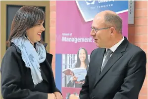  ?? Picture: FREDLIN ADRIAAN ?? TALK TIME: NMU’s School of Management Sciences director Professor Madele Tait welcomes new head for Ford Dr Casper Kruger to the campus