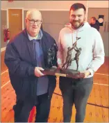  ?? ?? Brendan McCarthy receiving the Patsy O’Driscoll Trophy from Patsy’s son Rory.