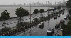  ??  ?? MUMBAI: Commuters drive in the rain along Marine Drive as Cyclone Nisarga barrels towards India’s western coast yesterday. — AFP