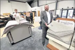  ??  ?? Left to right Josh Ashby Commercial Director, Andy Corden Retail Ops Manager and Jason Ashby Managing Director of UK Flooring Direct at their current home in Bayton Road Industrial Estate, Exhall pictured in the showroom late last year