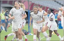  ?? RICARDO MAZALAN — THE ASSOCIATED PRESS ?? United States players warm up before a match against Sweden at the 2020 Summer Olympics on Wednesday in Tokyo.