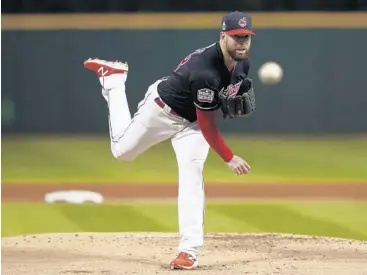  ?? ELSA GARRISON/ASSOCIATED PRESS ?? Indians starter Corey Kluber struck out 8 Chicago batters in the first 3 innings of Game 1 of the World Series Tuesday.