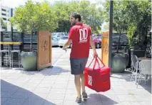  ?? RANDY VAZQUEZ/SUN SENTINEL ?? Delray Beach-based Delivery Dudes is taking extra precaution­s during the coronaviru­s pandemic to bring food to customers.