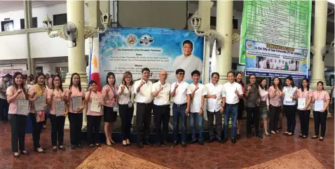  ?? -Princess Clea Arcellaz ?? OUTSTANDIN­G ECCD WORKERS. Mayor Edwin Santiago, Vice-Mayor Jimmy Lazatin, Sanggunian­g Panlunsod members and department heads award the outstandin­g ECCD workers during Monday’s flag ceremony at city hall.
