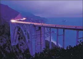  ?? Ricardo DeAratanha Los Angeles Times ?? THE BIXBY CREEK BRIDGE is a big draw for selfie-seeking tourists. Over the weekend, it was draped with a banner reading “Overtouris­m is killing Big Sur.”