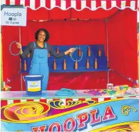  ??  ?? ●● Kiani Jeacock from AstraZenec­a manning the hoopla stall