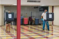  ?? COURANT FILE PHOTO ?? Voting booths at Conard High School in West Hartford in 2020. A bill proposed in Connecticu­t would demand an explanatio­n from each eligible voter who did not vote.