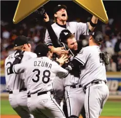  ?? LOUIS DELUCA/AP ?? White Sox players celebrate after the last out of their 1-0 clincher over the Astros in Game 4 of the 2005 World Series.