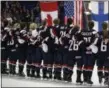  ?? CARLOS OSORIO — THE ASSOCIATED PRESS ?? The U.S. team stands during the national anthem after defeating Canada 3-2in overtime in the title game of the women’s hockey world championsh­ips, Friday, April 7, 2017in Plymouth, Mich.