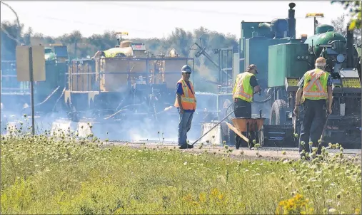  ?? COLIN MACLEAN/JOURNAL PIONEER ?? A crew with M and M Resources is using a new-to-Canada asphalt recycling system to repair a section of Highway 1A in Albany.