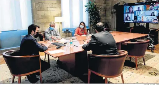  ?? QUIQUE GARCÍA / EFE ?? El presidente de la Generalita­t, Pere Aragonès, durante la reunión ayer del comité de seguimient­o del Covid para abordar un toque de queda nocturno.