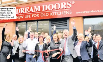  ??  ?? Opening doors Provost Helen Moonie cuts the ribbon at the store in Prestwick