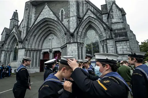  ?? BRADEN FASTIER/STUFF ?? Members of the Sea Cadet Corp regroup after the memorial service for Queen Elizabeth II at Nelson’s Christ Church Cathedral on Saturday.