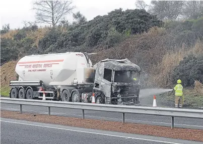  ?? Pictures: Mhairi Edwards/Kim Cessford. ?? Top left and bottom right: the emergency services’ response to the fatal collision on the A90. Above left and top right: a firefighte­r dousing the cab that caught fire, and tailbacks following the blaze.