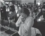  ?? JUNFU HAN/ USA TODAY NETWORK ?? Mourners gather for a vigil Tuesday at LakePoint Community Church in Oxford Township, Mich.