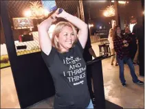  ?? Arnold Gold / Hearst Connecticu­t Media ?? Cara Higgins of Key West, Fla., tries out ax throwing at Montana Nights Axe Throwing in Orange on Friday. Besides ax throwing, the establishm­ent offers a bar, pizza, darts and pool tables.