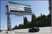  ?? JANE TYSKA — STAFF ARCHIVES ?? A motorist passes a sign for the carpool toll lane along I-680 near Walnut Creek in 2019. Trucks with only two axles can use the lanes.