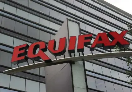  ?? Mike Stewart / Associated Press ?? Equifax says a special committee has determined that four executives did not commit insider trading prior to public disclosure of its massive data breach.