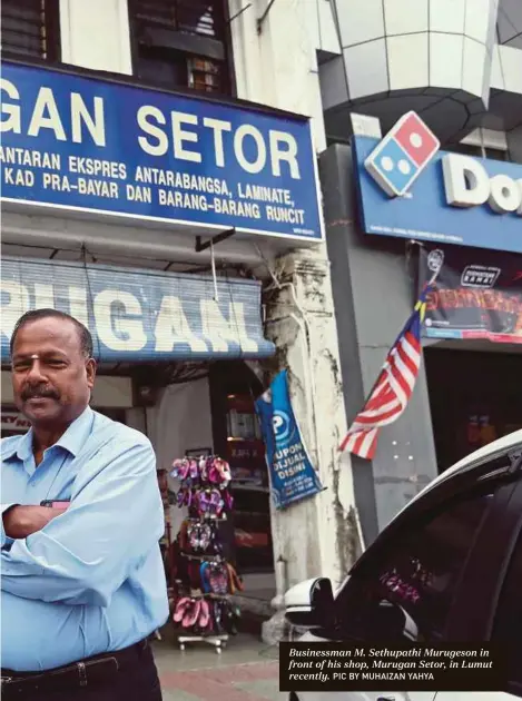  ?? PIC BY MUHAIZAN YAHYA ?? Businessma­n M. Sethupathi Murugeson in front of his shop, Murugan Setor, in Lumut recently.