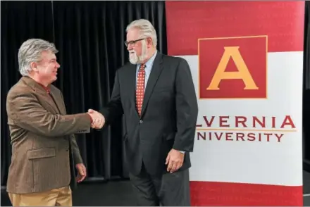  ?? PHOTO COURTESY MATTHEW WRIGHT ?? Attending a June 5 ceremony at Montgomery County Community College are MCCC President Kevin Pollock, left, and Alvernia University Provost Jerry Greiner. Alvernia University has joined Montgomery County Community College’s University Center and will offer two advanced degrees college’s west campus in Pottstown — a Master of Business and a Master in Education.