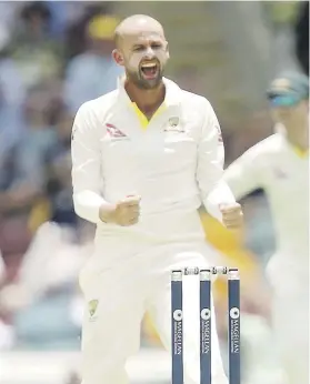  ?? Picture: EPA-EFE ?? ANOTHER VICTIM. Australia’s Nathan Lyon celebrates after taking the wicket of England’s Moeen Ali on the second day of the first Ashes Test at the Gabba yesterday.