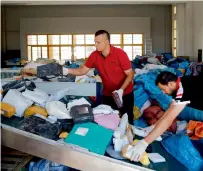  ?? AP ?? Palestinia­n postal workers sift through the mail at a post office in the West Bank city of Jericho on Sunday. —