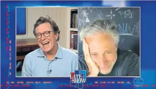  ?? THE LATE SHOW YOUTUBE ?? Jon Stewart, right, tells Stephen Colbert why Biden is “the man of the moment” for the U.S.