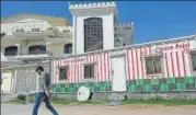  ??  ?? A man walks past the office of Falah-e-insaniat Foundation, a charity believed to be set up by Jamaat-ud-dawa as a front, in Islamabad. AFP