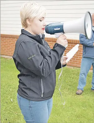  ?? DAVE STEWART/THE GUARDIAN ?? Josie Green, a Grade 11 student at Kensington Intermedia­te Senior High School, speaks at a rally Monday in front of the Public Schools Branch office in Stratford. She said losing teachers would result in an end to some of the programs the school offers.