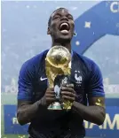  ?? /Getty Images ?? Paul Pogba of France, with World Cup trophy at the 2018 rendition.