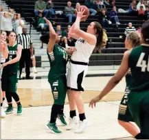  ?? TIM GODBEE / For the Calhoun Times ?? Calhoun’s Lyndi Rae Davis (right) goes up over Adairsvill­e’s Coriana McDaniel for the game-winning shot in overtime.