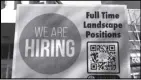  ?? ASSOCIATED PRESS ?? A hiring sign is displayed in Des Plaines, Ill. The Labor Department reported Thursday the number of people who applied for unemployme­nt last week dropped to 218,000.