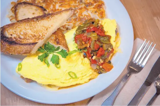  ?? EDDIE MOORE/JOURNAL ?? A Santa Fe omelet is one of the offerings at Dolina Santa Fe Cafe & Bakery.