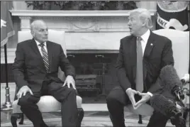  ?? The Associated Press ?? CHIEF OF STAFF: President Donald Trump talks with new White House Chief of Staff John Kelly after he was privately sworn in during a ceremony in the Oval Office Monday in Washington.