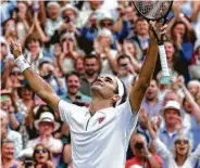  ?? Clive Brunskill / Getty Images ?? Roger Federer exults after prevailing in four sets against Rafael Nadal, the 40th match pitting the pair.