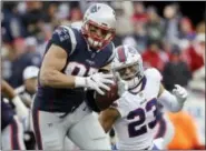  ?? STEVEN SENNE — THE ASSOCIATED PRESS ?? New England Patriots tight end Rob Gronkowski, left, runs from Buffalo Bills safety Micah Hyde (23) after catching a pass during the second half of an NFL football game, Sunday in Foxborough, Mass.